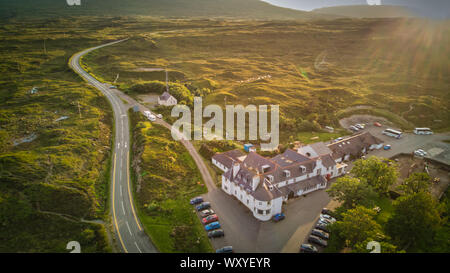 Sligachan Hotel and parked cars around, standing on the road in Glen Sligachan, Isle of Skye, aerial view Stock Photo