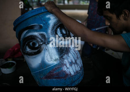 Bangladesh. 18th Sep, 2019. Young artist making head of a giant sculpture made of plastic which will be displayed in a rally of global climate strike as protest. Global climate strike will be held on 20th September to 27th September. (Photo by Md. Rakibul Hasan/Pacific Press) Credit: Pacific Press Agency/Alamy Live News Stock Photo