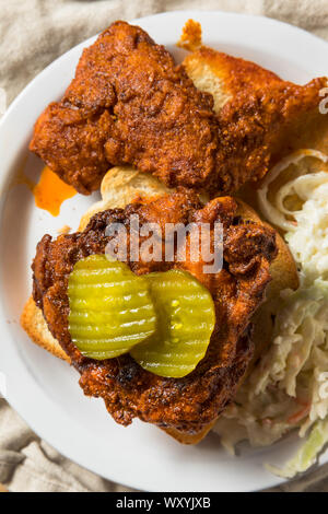 Homemade Nashville Hot Chicken with Bread and PIckles Stock Photo