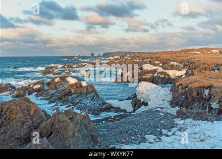 Ice covered rocks along Newfoundland coast Stock Photo