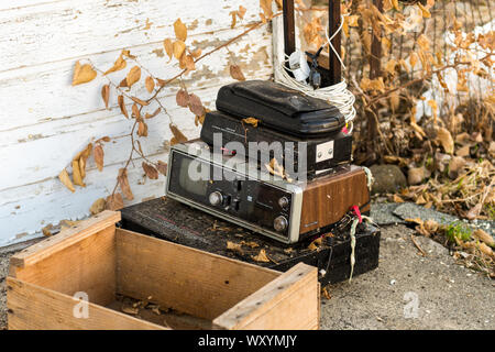Old abandoned video, television and radio devices on the ground in Maryhill Stock Photo