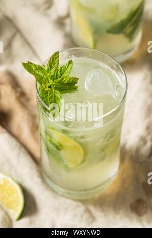 Sweet Mint Rum Mojito with Limes and Soda Water Stock Photo