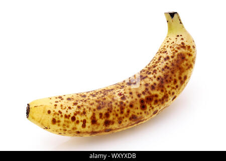 Close up of an over-ripe banana isolated on white background Stock Photo