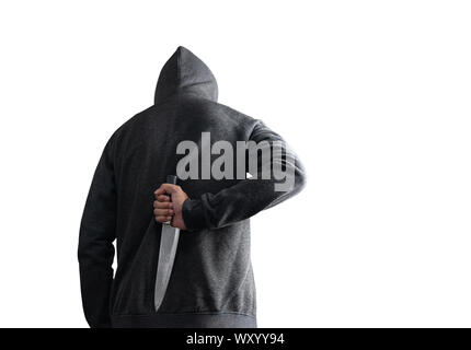 The bandits in the black hold a knife hidden behind on white background. with clipping path. Stock Photo