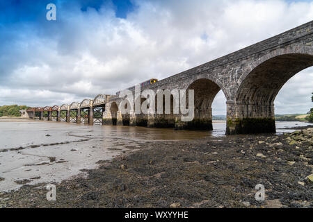Rail Bridge over the River Tavy Devon Dartmoor Plymouth for the Tamar Valley Passenger Railway with Train on the Bridge Stock Photo