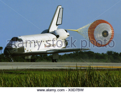 With its drag chute deployed Space Shuttle Discovery slows to a stop ...