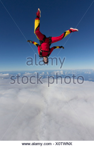 Female Skydiver Free Falling Upside Down Over Grenchen, Berne Stock ...