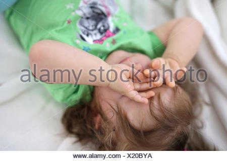 Portrait Of Baby Girl Rubbing Eyes Stock Photo Alamy