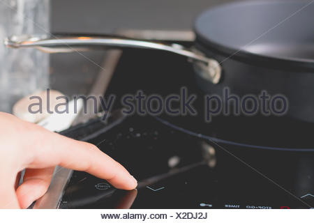 Cook Is Switching On The Induction Cooktops Stock Photo 169867238