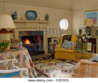Upholstered Armchair Next To Fireplace In Neutral Colour Sitting