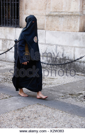 Penitent in traditional hood and robe in an Easter parade on Holy ...