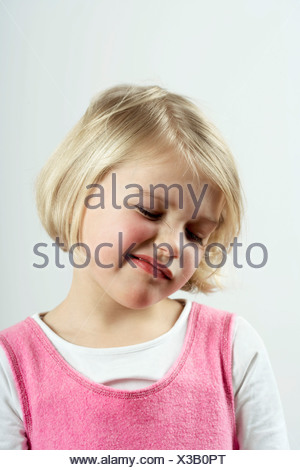 A young girl with a skeptical look