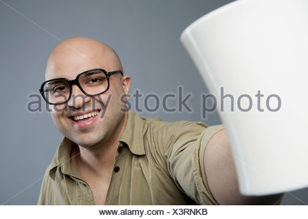 Bald man with a mug of tea