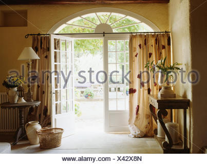 Open Half Glazed Double Doors With View Of Glassware On Circular