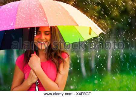 Beautiful woman under rainbow umbrella Debica, Poland