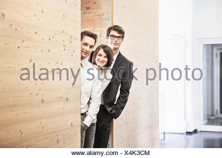 man peeking around the corner of an office cubicle Stock Photo: 7048890 ...