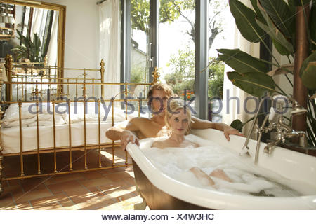 https://l450v.alamy.com/450v/x4w3hc/bedroom-bath-couple-proper-bath-together-recreation-20-30-years-partnership-respect-love-falls-in-love-romanticism-bubble-bath-have-of-a-bath-care-personal-care-body-hygiene-enjoy-rest-take-it-easy-affection-tenderness-erotically-interior-arrangement-interior-setup-extravagant-brass-bed-luxury-inside-live-unusually-extremely-x4w3hc.jpg