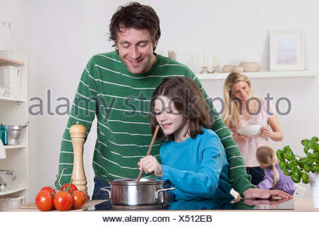 father daughter munich bavaria germany cooking mother alamy background son