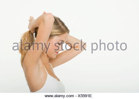 Girl Putting Hair In Ponytail Side View Stock Photo 60248190 Alamy