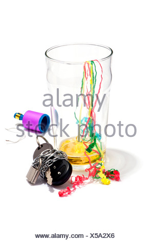 An empty pint of beer, streamers and a car key chained and padlocked