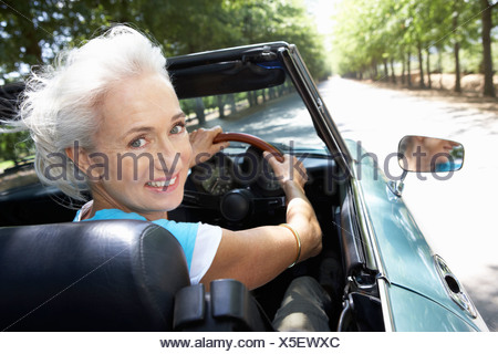 Senior woman in her sports car Stock Photo - Alamy