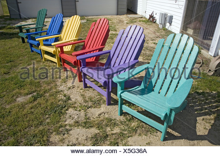 Rainbow colored wooden chairs, known as "Maine Chairs 
