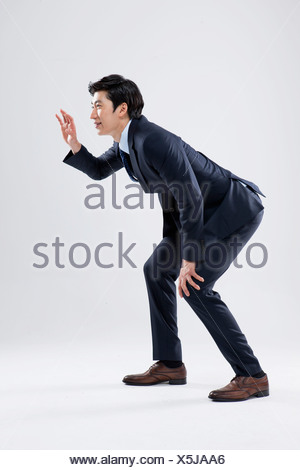 A Businessman Being Wary Of Something Stock Photo Alamy