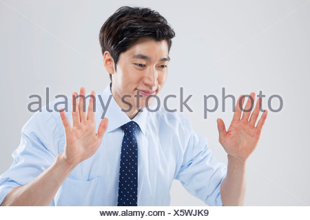 A Businessman Being Wary Of Something Stock Photo Alamy