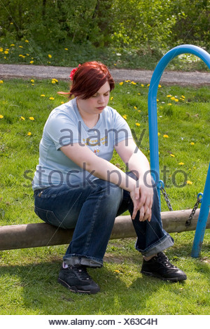 https://l450v.alamy.com/450v/x63c4h/plus-sized-young-woman-sit-in-park-thinking-looking-down-sad-and-lonely-x63c4h.jpg