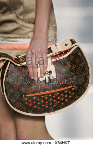 Woman holding a Louis Vuitton handbag Stock Photo: 37437920 - Alamy