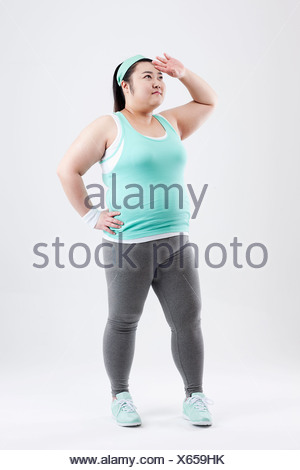a fat girl standing in a gym outfit Stock Photo: 61857487 - Alamy