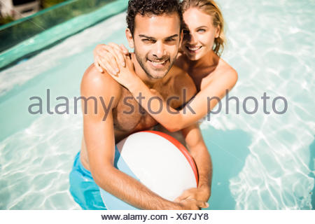 Happy couple with beach ball