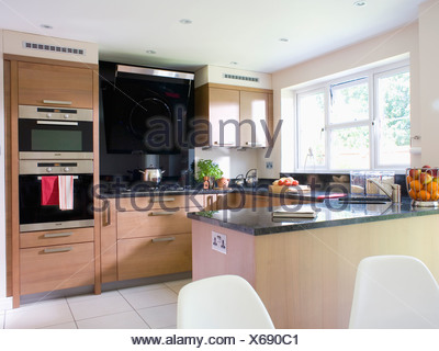 Eye-level double oven in white fitted unit in modern town-house Stock ...