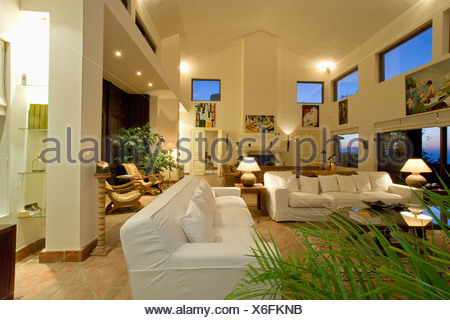 White Sofas In A Large Double Height Living Room With A Mezzanine