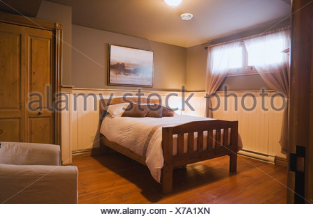 Basement Bedroom Inside A Replica Canadiana Cottage Style Home