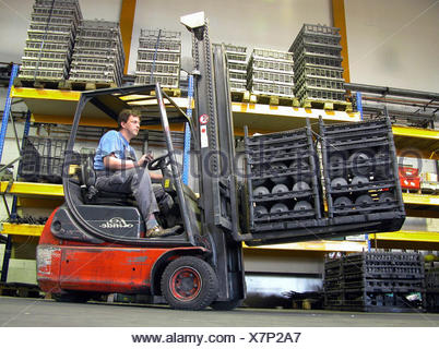 Forklift truck in a storage hall