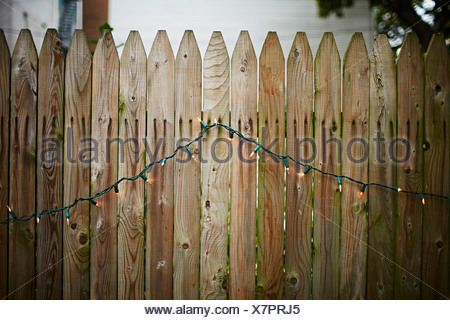 Wooden garden fence with fairy lights Stock Photo: 57599231 - Alamy