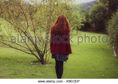 Rear View Of Woman In Park