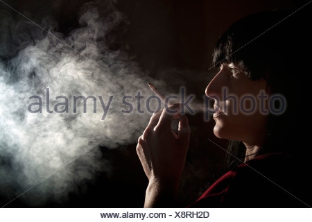 Illuminated profile of woman smoking Stock Photo: 43869231 - Alamy