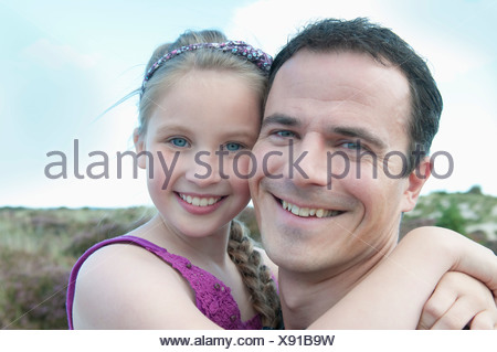 Father and daughter smiling together