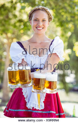 Pretty young german oktoberfest blonde woman in a dirndl dress with ...