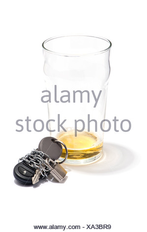 An empty pint of beer and a car key chained and padlocked