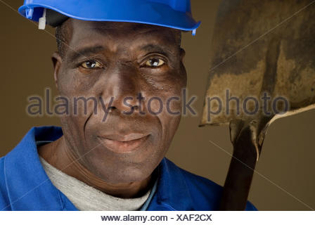 African American Construction Worker Resting Shovel on His Shoulder ...