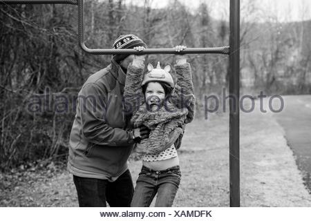 Father And Daughter Playing In Park