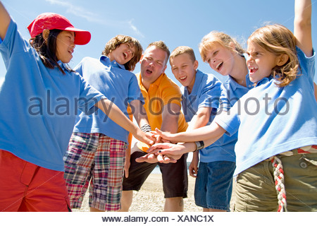 Young teenage boy screaming in pain with blood prosthetics 