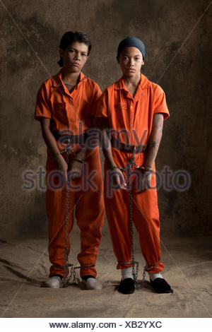 Studio portrait of two boys in handcuffs and chains Stock Photo ...