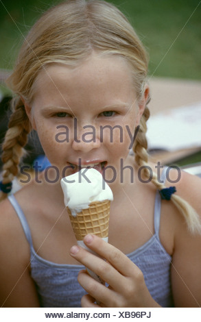Mfemale Child With Blonde Hair Off Face In Two Plaits Eating