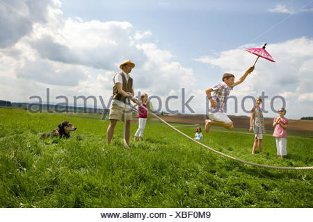 Happy people jump roping in countryside