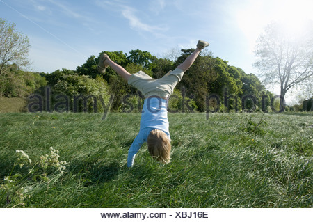 Young boy doing handstand in school playground Stock Photo: 92302860 ...