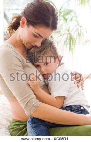 Mother hugging sad son Stock Photo: 32344345 - Alamy